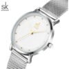 reloj shengke, color plateado dama.